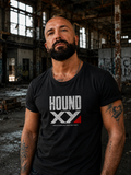 Man wearing the HOUND XY Raw Instinct graphic T-shirt in an abandoned industrial warehouse.